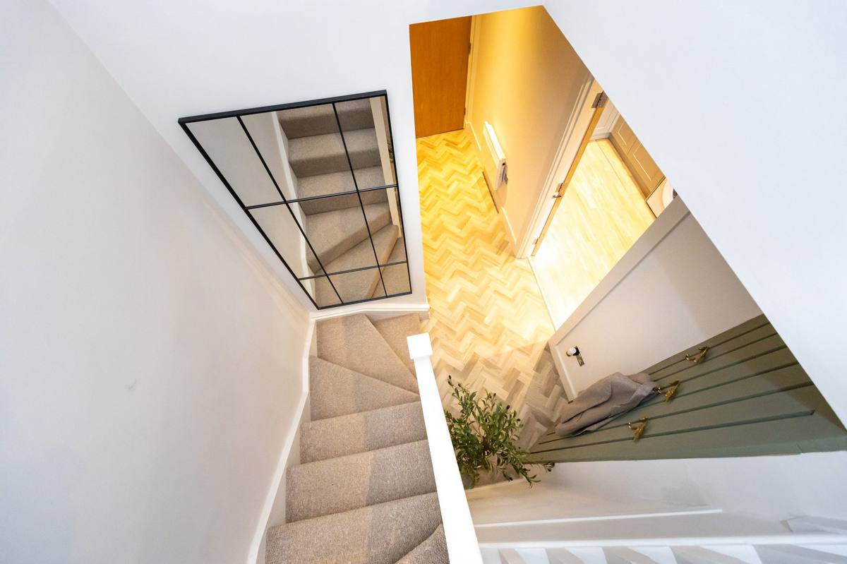 Stairway with mirror and greenery